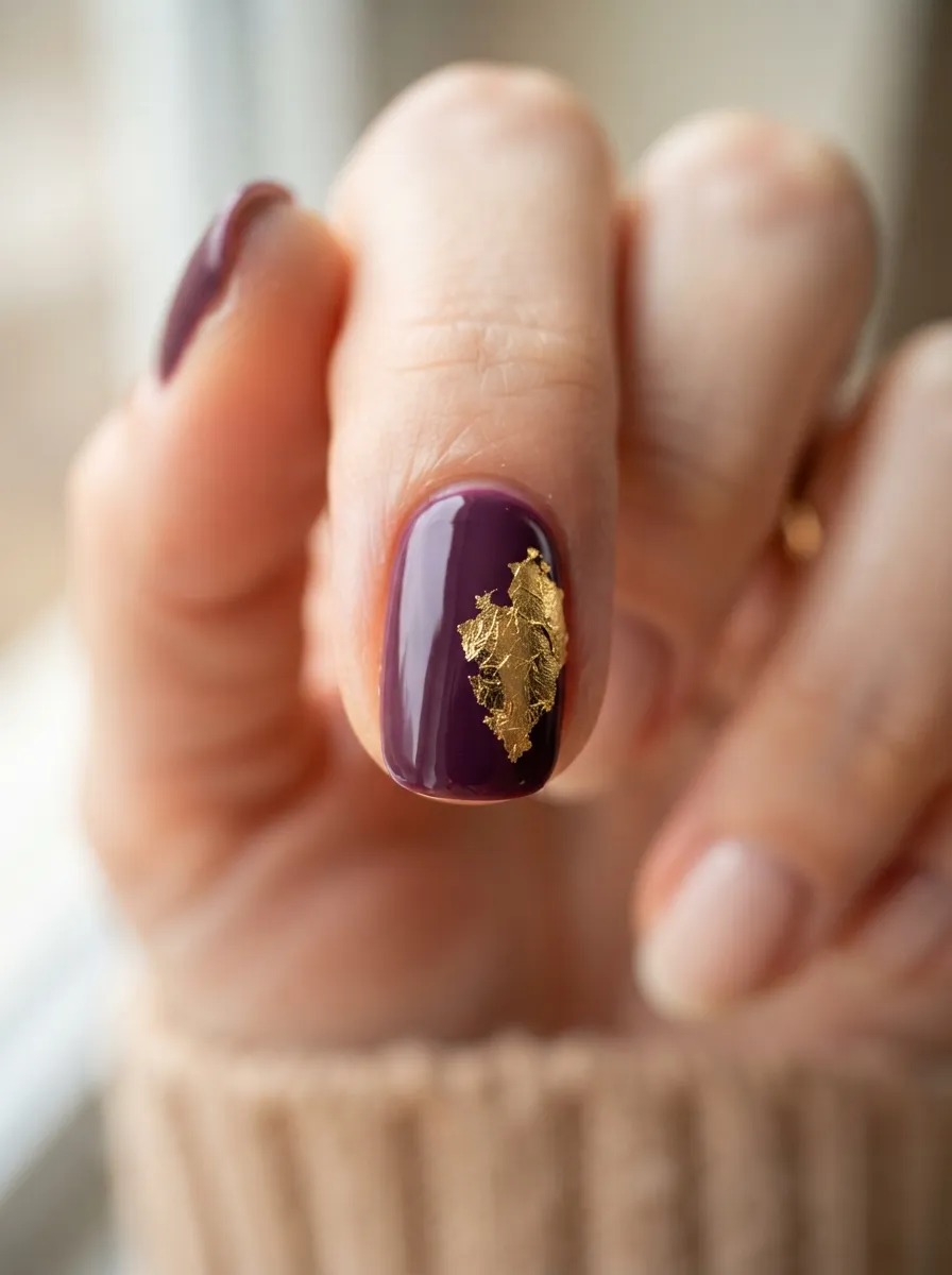 Gold Leaf Accent Nail on Plum Polish